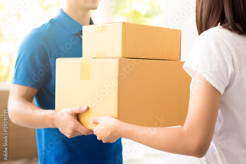 Woman receiving packages from courier