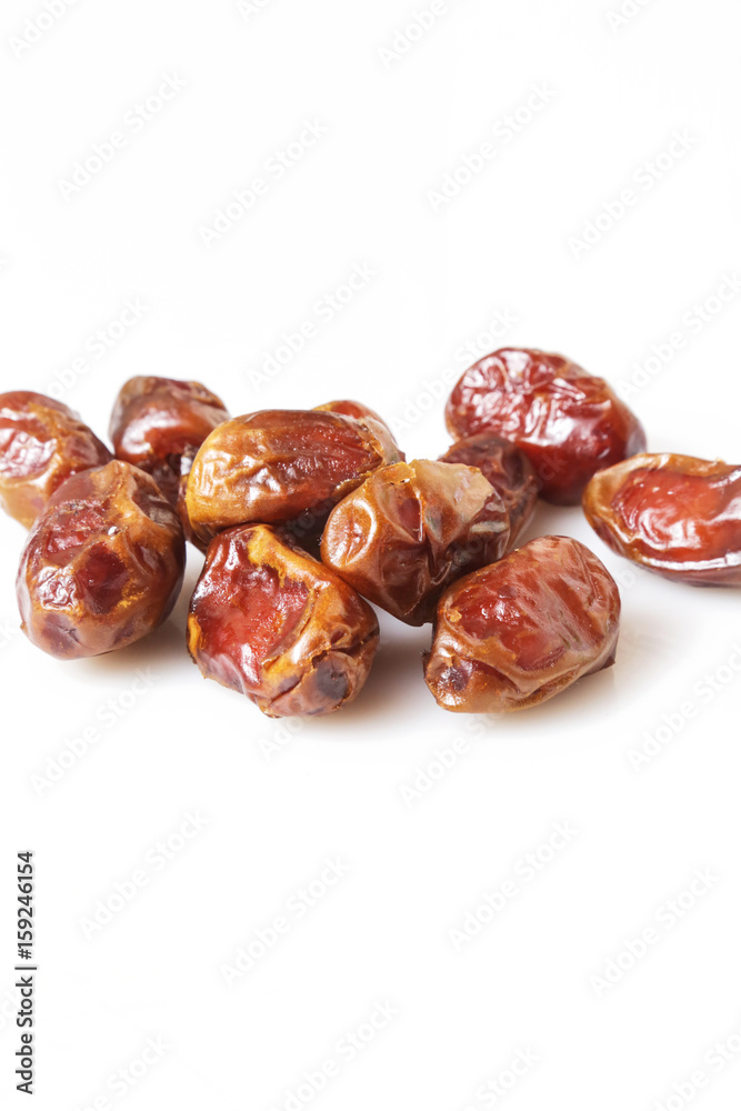 Dried dates - studio shoot on the white Dried dates - studio shoot on the white