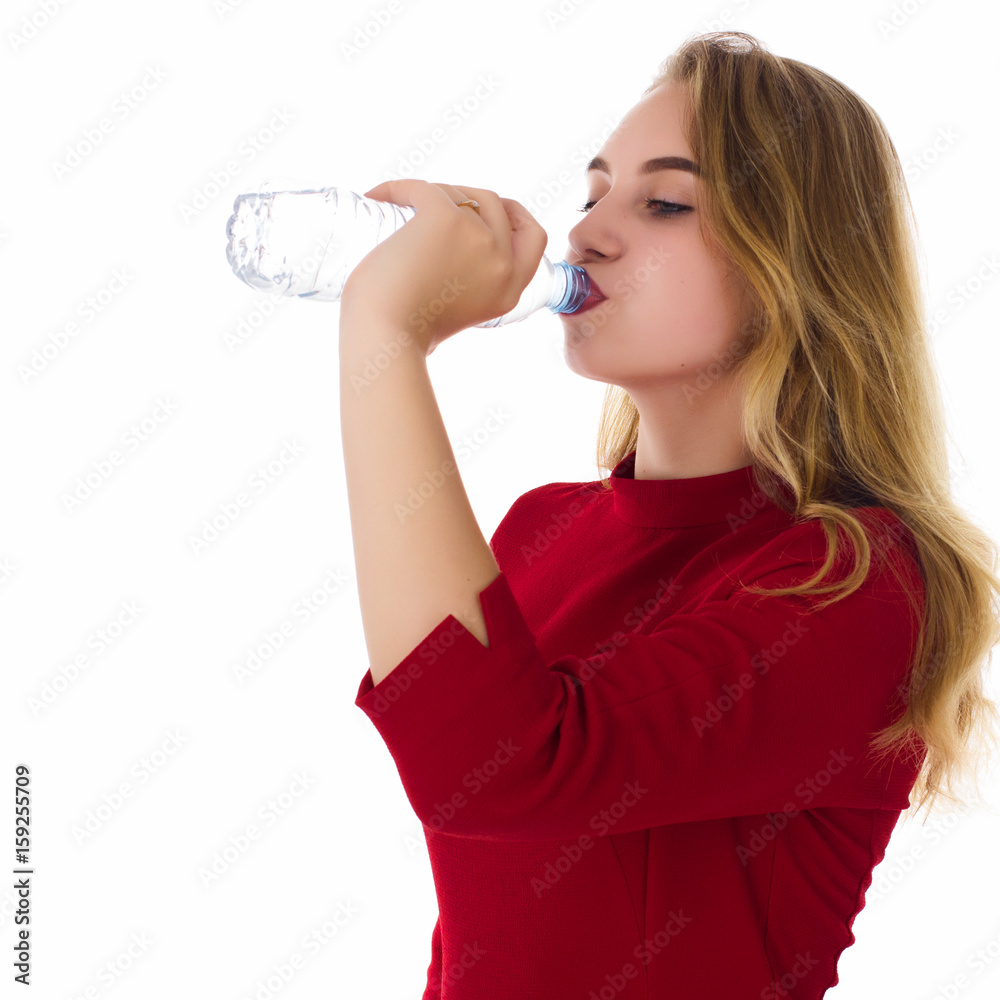 Young pretty girl drinks fresh water  