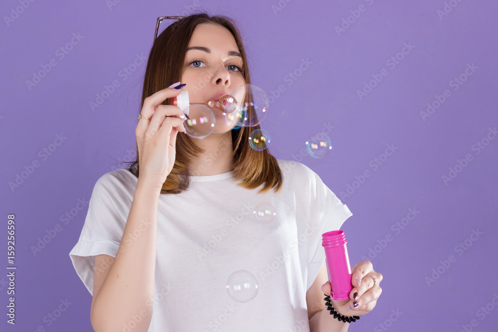 Young cute girl blows bubbles, pretty woman Young cute girl blows bubbles, pretty woman