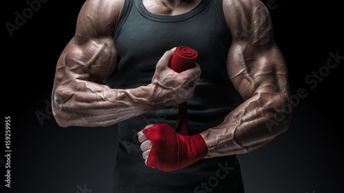 Close-up photo of strong man wrap hands