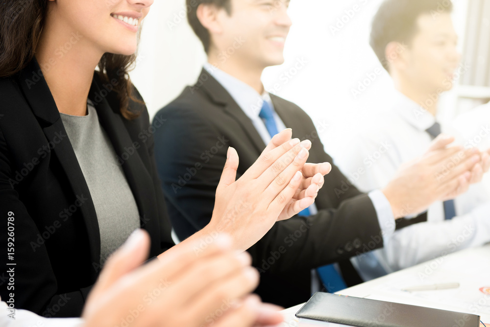 Business people clapping their hands at the meeting Business people clapping their hands at the meeting