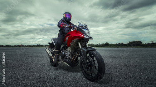 Motorcycles, bicycles, protective gear and gloves, and helmets are driving big bike. © mteeandt