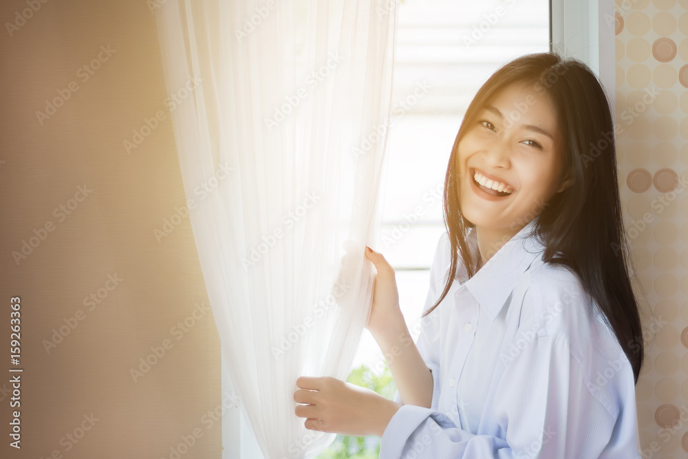 Asian Beautiful Woman relaxing at the window. Asian Beautiful Woman relaxing at the window.
