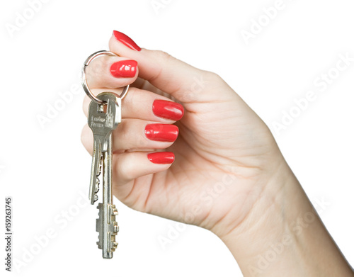 Obraz na płótnie A woman's hand with a beautiful manicure holds a bunch of keys. w salonie