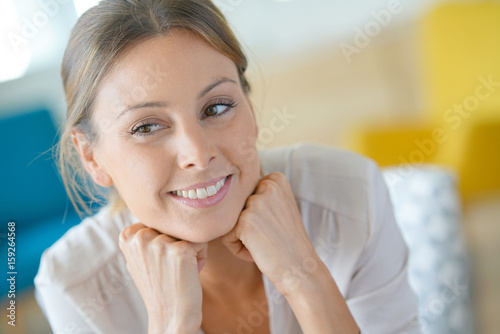 Free Download Portrait of beautiful woman relaxing at home - GFXLoad