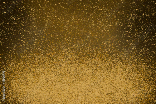 gold glitter or dust light with defocused background, star or space concept
