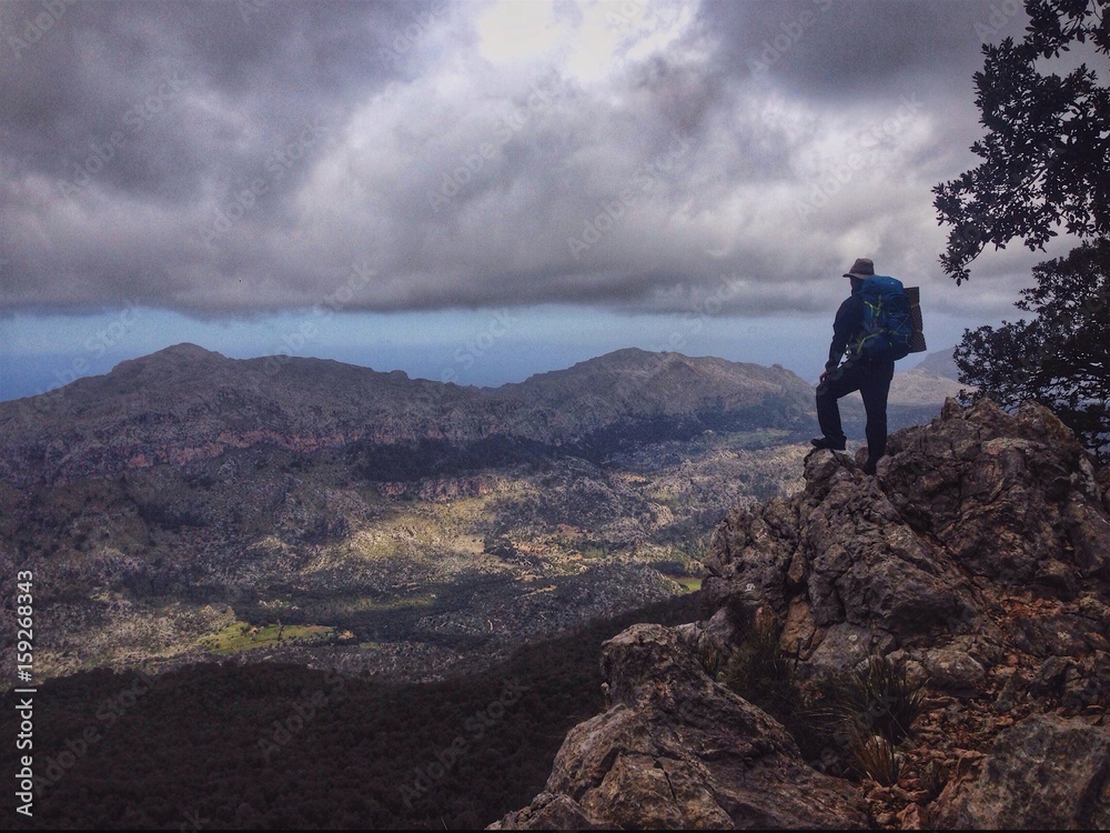 Hiker in the Tramuntana mountains, Mallorca, Spain Hiker in the Tramuntana mountains, Mallorca, Spain