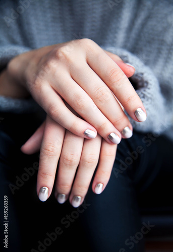 Stylish gray manicure with overflowing  Fashion  hands  fingers