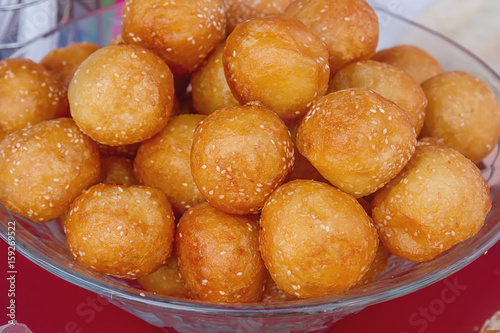 Homemade pancake balls (cinnamon recipe) deep fried - by dropping spoonfuls of batter into fryer.
