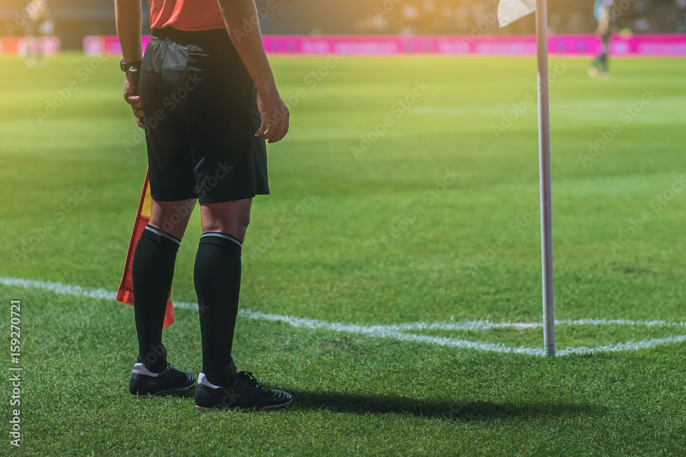 Obraz premium Lineman assistant referee at the corner of a soccer field.