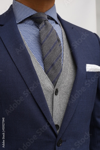 close up of man in a suit with tie and handkerchief