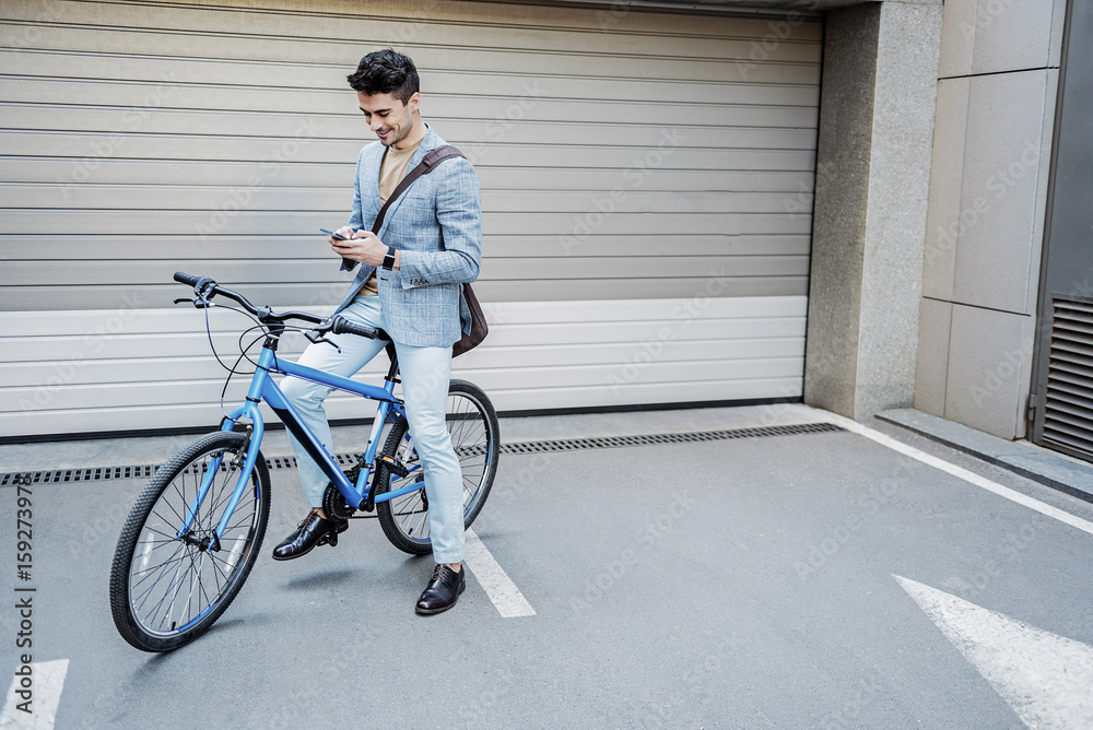 Fototapeta premium Interested busy male person using phone
