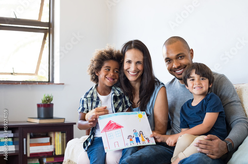 Multiethnic family on sofa photo