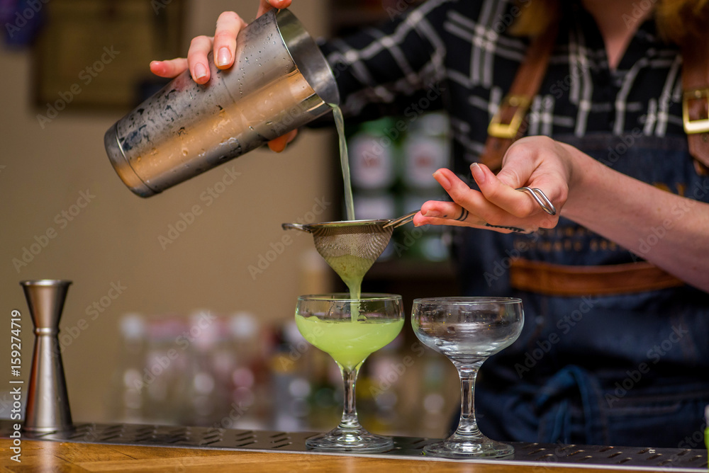 Bartender makes a cocktail