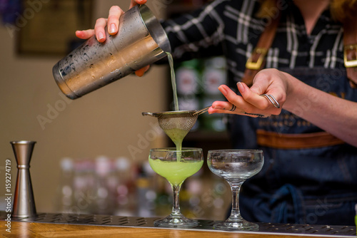 Bartender makes a cocktail