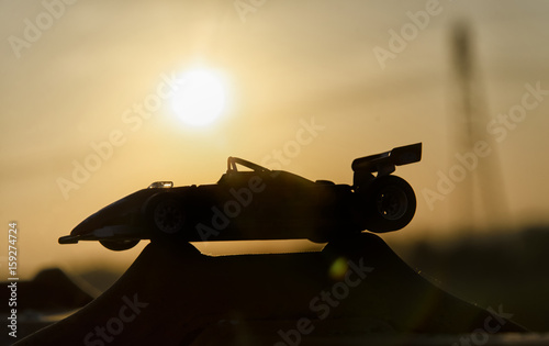 Historic single-seater with sunset in background