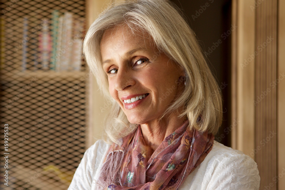 Close up middle aged woman smiling Close up middle aged woman smiling