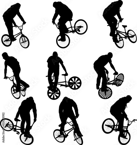 BMX stunt cyclist silhouettes - vector