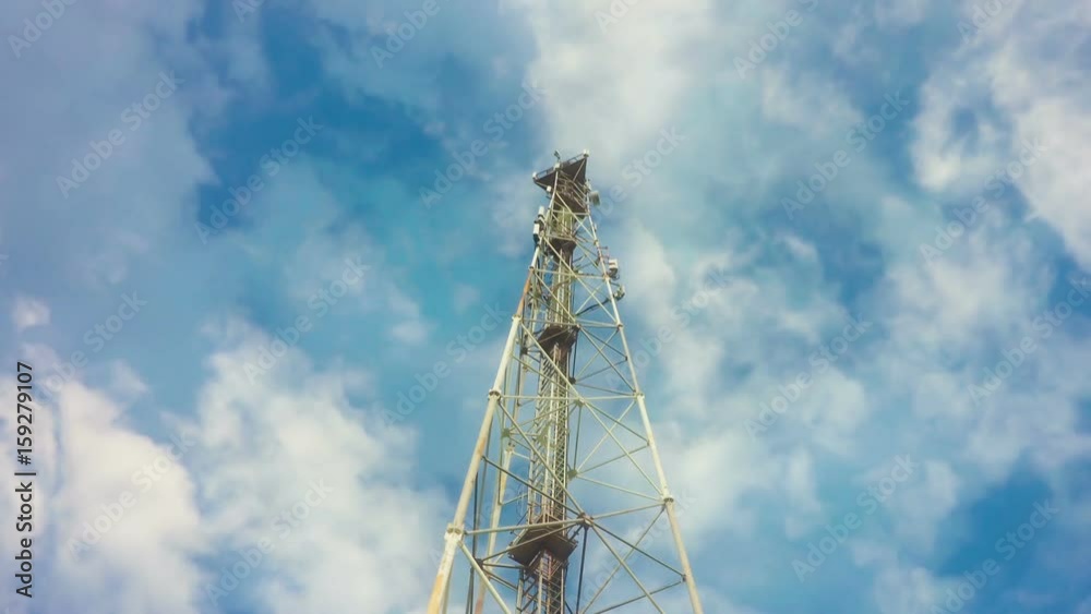 TimeLapse of a cloudy daytime sky with a GSM base station, loop video TimeLapse of a cloudy daytime sky with a GSM base station, loop video