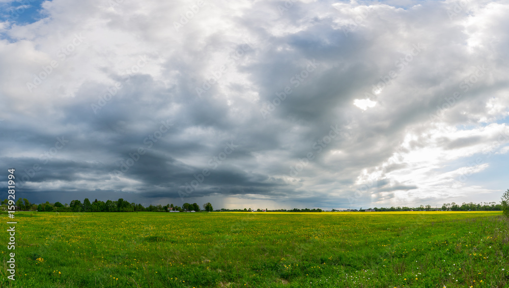 Green meadow under blue sky with clouds. Nature landscape panorama. Green meadow under blue sky with clouds. Nature landscape panorama.