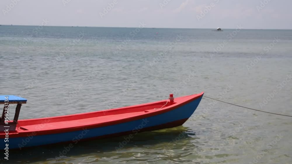 Vietnamese red fishing boat in Phu Quoc island, Vietnam Vietnamese red fishing boat in Phu Quoc island, Vietnam