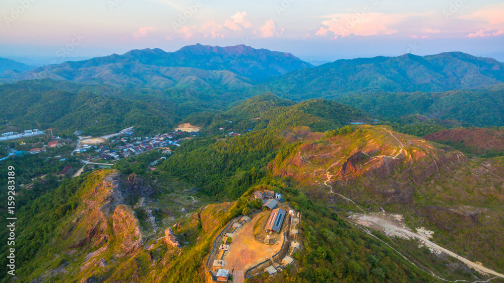 Fototapeta premium a small dirt road to hilltop near the border