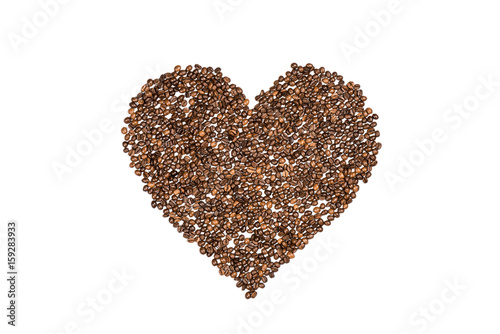 Heart symbol made from coffee seeds isolated on white