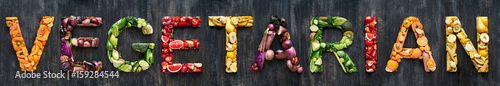 Vegetarian spelt out in colourful fruits and vegetables photo