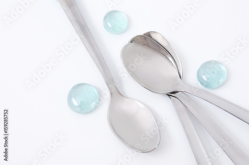 Silver spoons on a white background