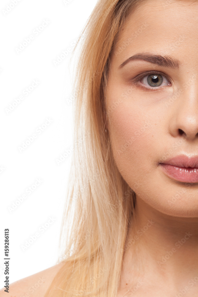 Beautiful a bit overweight girl on white background in studio photo