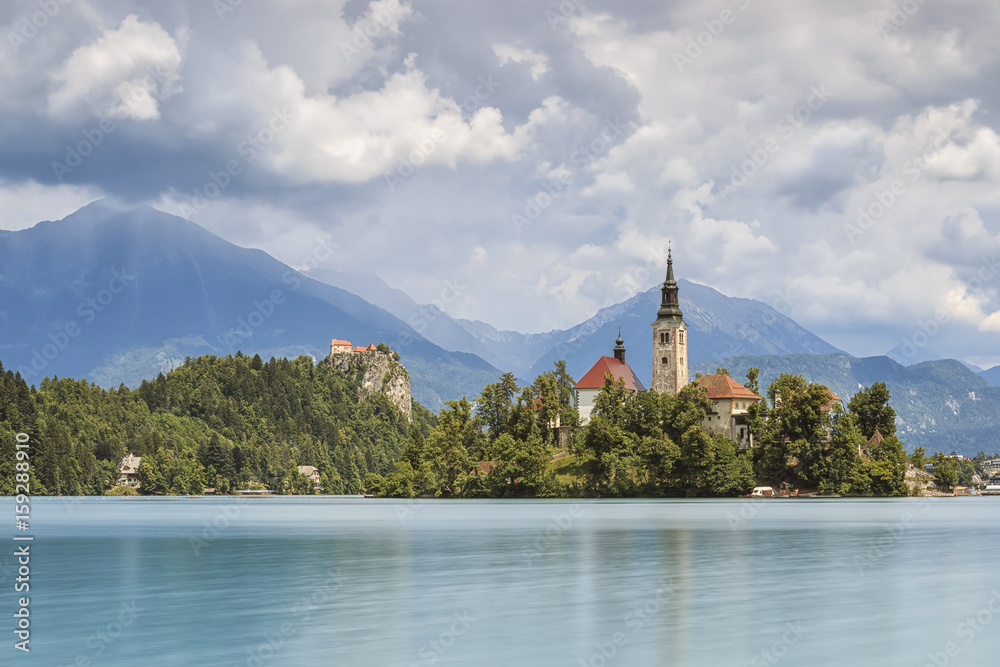 Beautiful view of Lake Bled with Island, Church And Castle With Mountain Range (Stol, Vrtaca, Begunjscica) In The Background- Bled, Slovenia, Europe