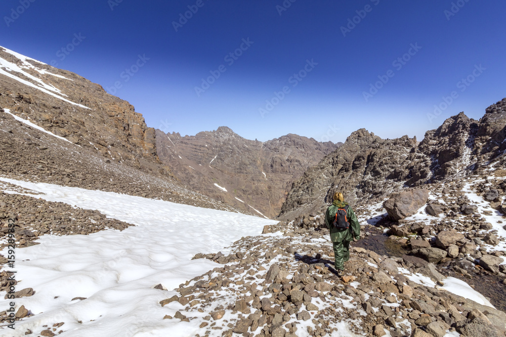 Toubkal national park, the peak whit 4,167m is the highest in the Atlas mountains and North Africa, trekker trail view.