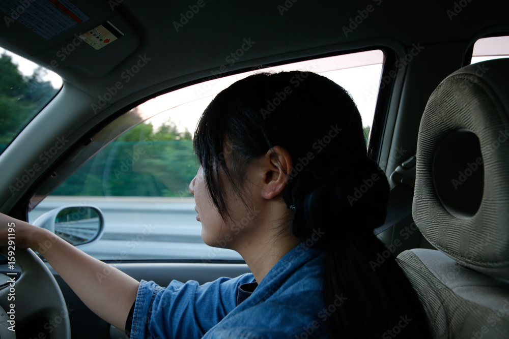 young asian woman driver driving