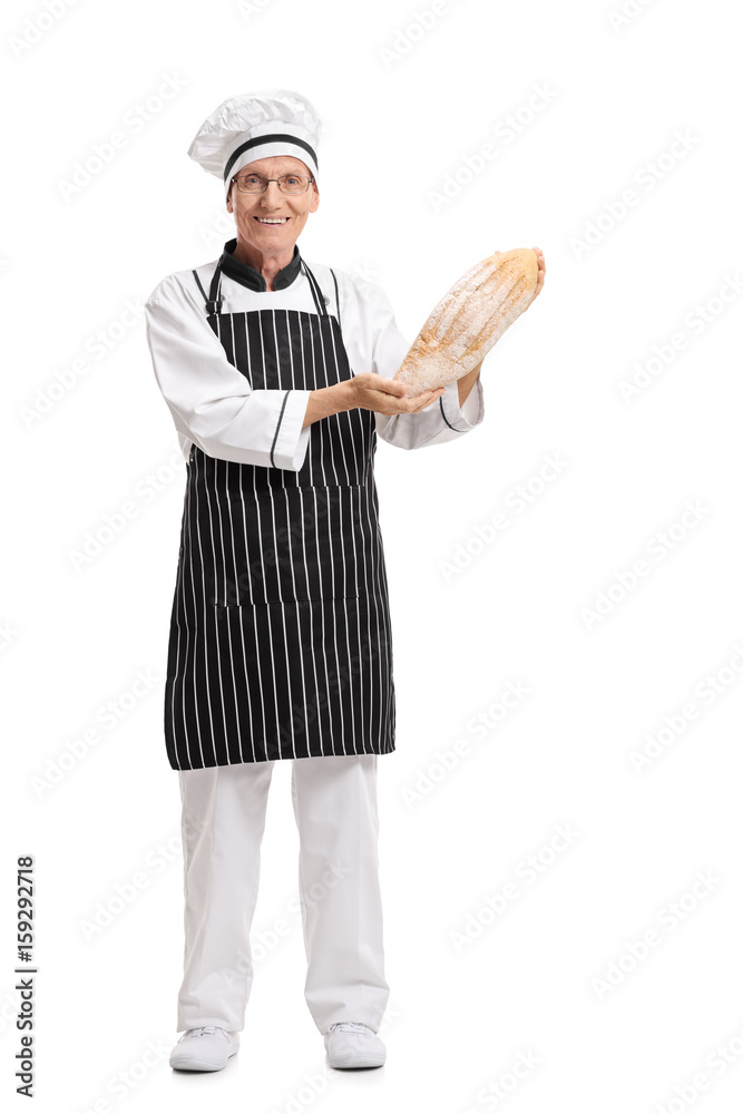 Baker holding a loaf of bread Baker holding a loaf of bread