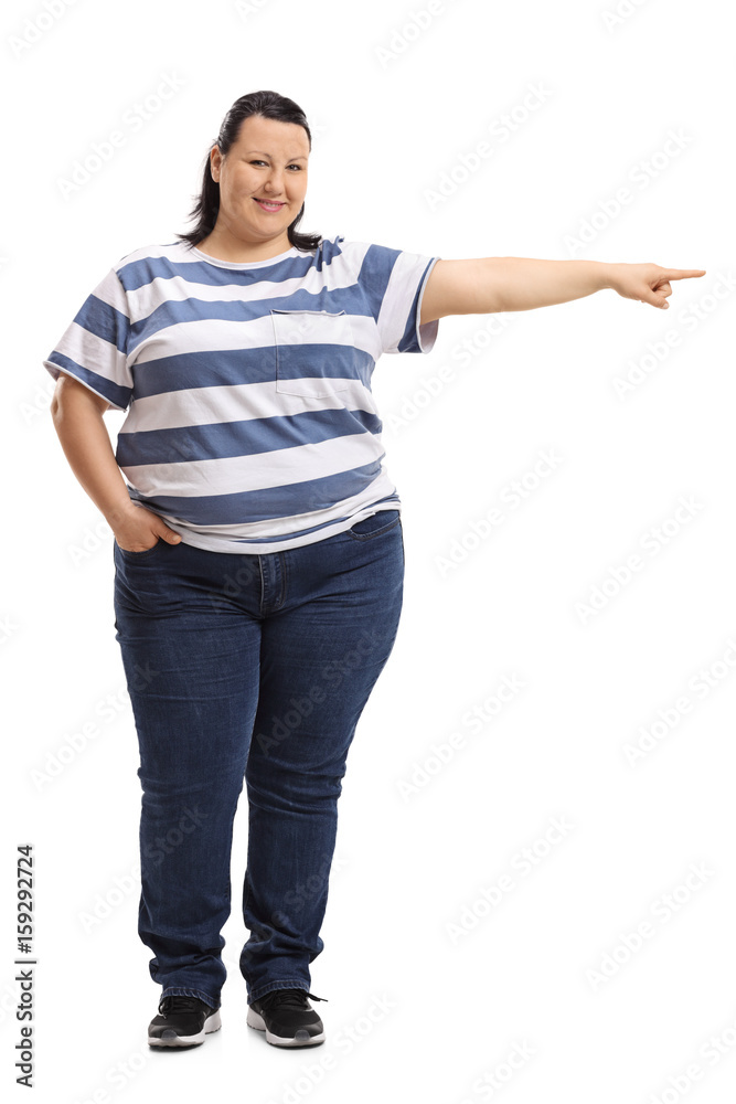 Woman pointing right and looking at the camera Woman pointing right and looking at the camera