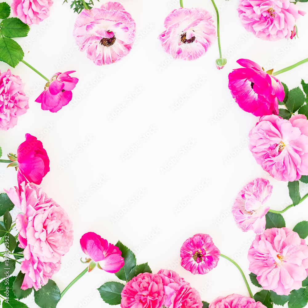 Round wreath frame of pink ranunculus flowers, roses, peony and leaves on white background. Floral lifestyle composition. Flat lay, top view.