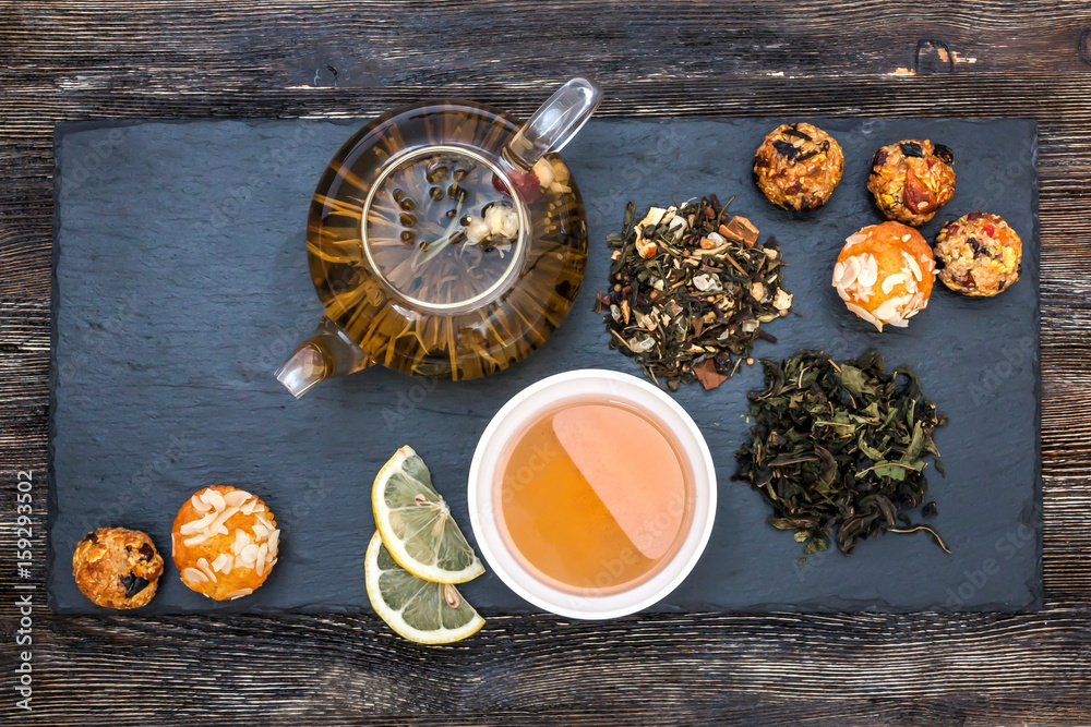 Green tea with cake, dried fruits and chocolate Green tea with cake, dried fruits and chocolate