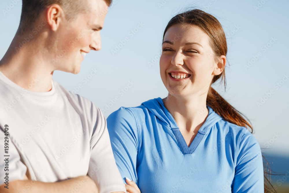Young couple on beach training together Young couple on beach training together