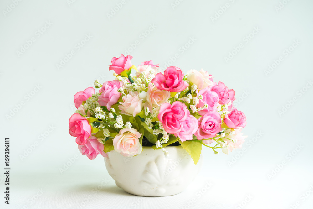 Rose fake flower and Floral background. rose flowers made of fabric. The fabric flowers bouquet. Colorful of decoration artificial flower, top view