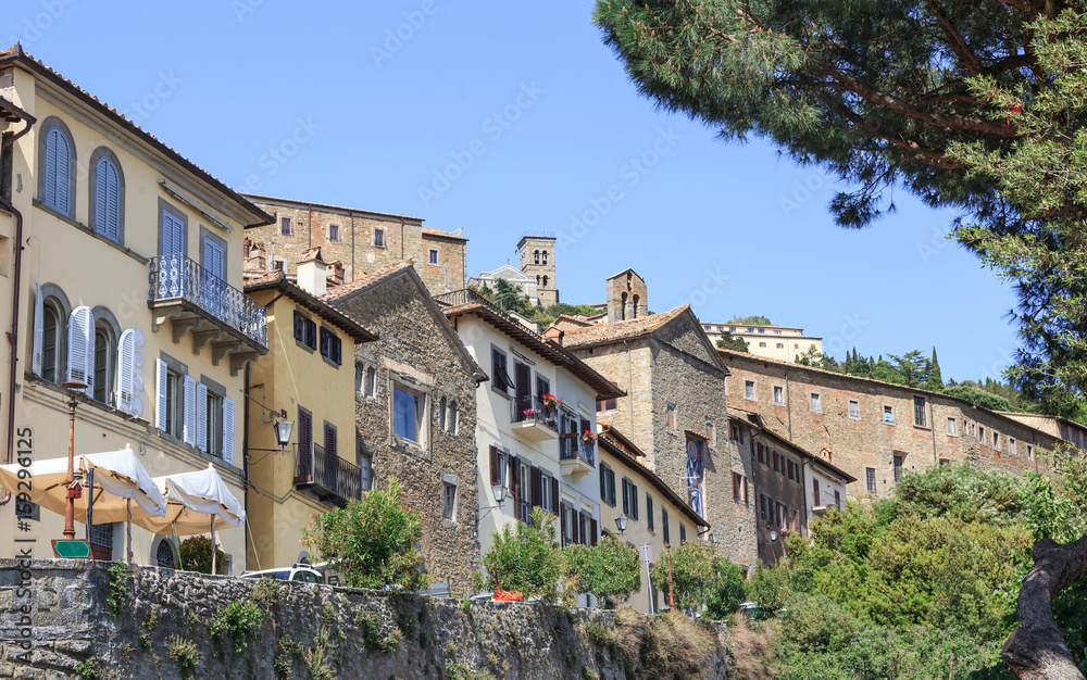Cortona, Tuscany, Italy - Via Santa Margherita with characteristic houses on edge of  hill