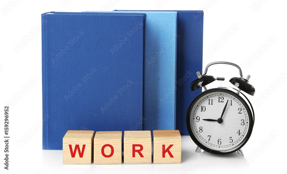 Cubes with alarm clock and books on white background. Time concept Cubes with alarm clock and books on white background. Time concept