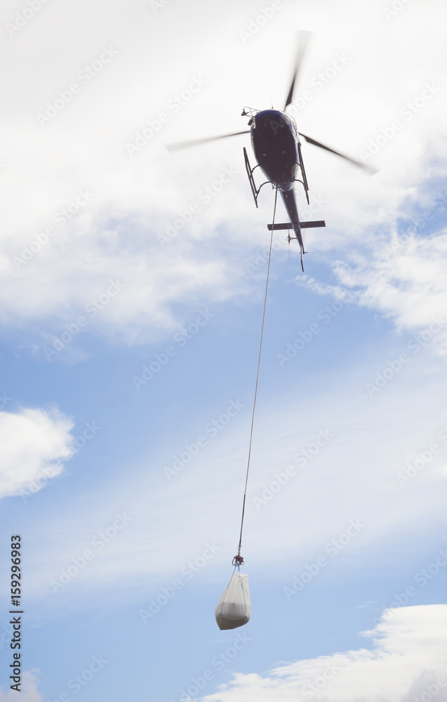 helicopter carry sand for construction industry