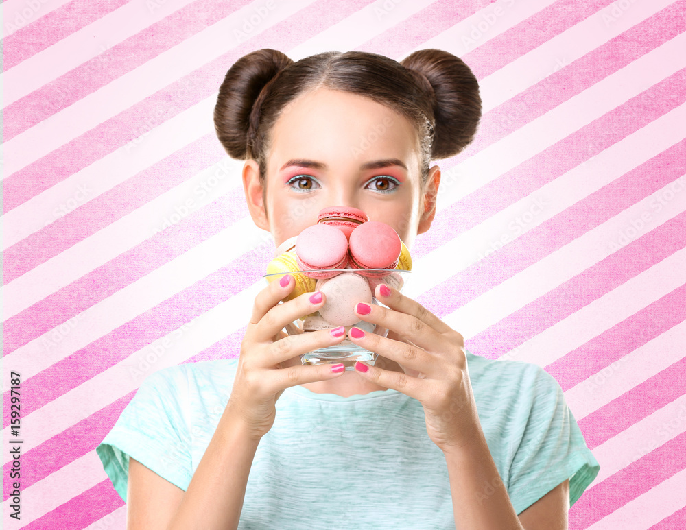 Cute girl with macaroons on white background