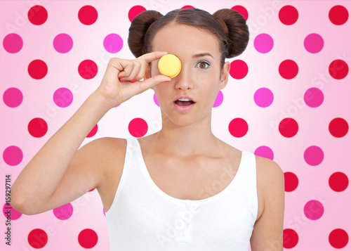 Cute girl with macaroon on ...