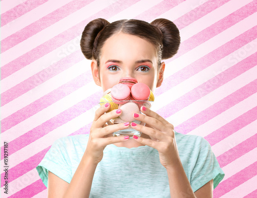 Cute girl with macaroons on...
