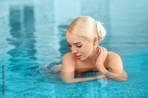 Beautiful girl in swimming pool © Africa Studio