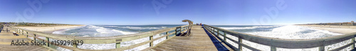 Tourists walk along St Johns County Ocean Pier in St Augustine  FL