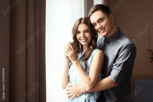Beautiful young couple at home