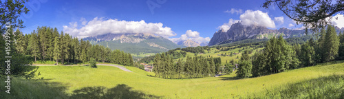 Beautiful panoramic view of mountains and meadows, Italian Alps in summer season